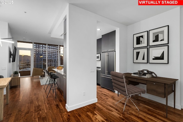 949 NW Overton St Unit 1304, Portland, OR 97209 - corridor featuring dark wood-type flooring, an office area, baseboards, recessed lighting, and a wall of windows