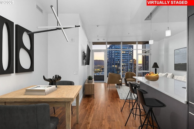 949 NW Overton St Unit 1304, Portland, OR 97209 - dining room with wood finished floors and floor to ceiling windows