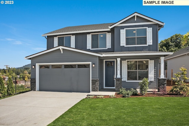 view of front of house with a front lawn, fence, stone siding, board and batten siding, and driveway