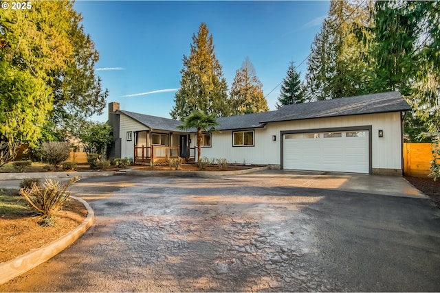 view of front of property featuring a garage and covered porch