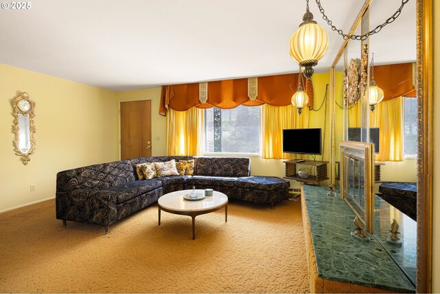 carpeted living room with baseboards