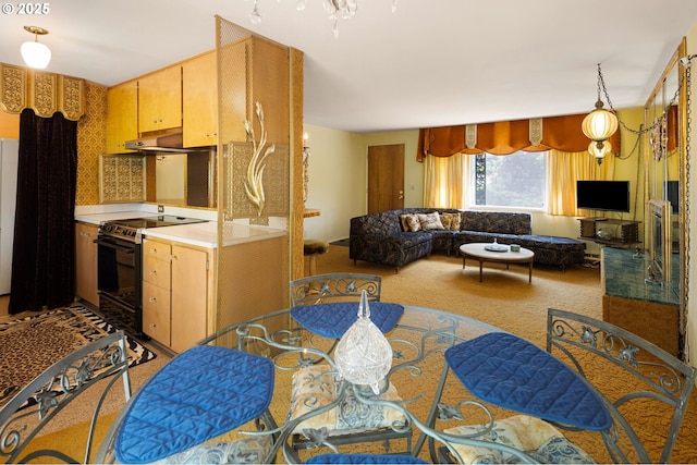 kitchen featuring black electric range, carpet, light countertops, under cabinet range hood, and open floor plan
