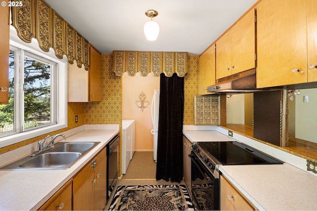 kitchen with black appliances, a sink, light countertops, under cabinet range hood, and tasteful backsplash
