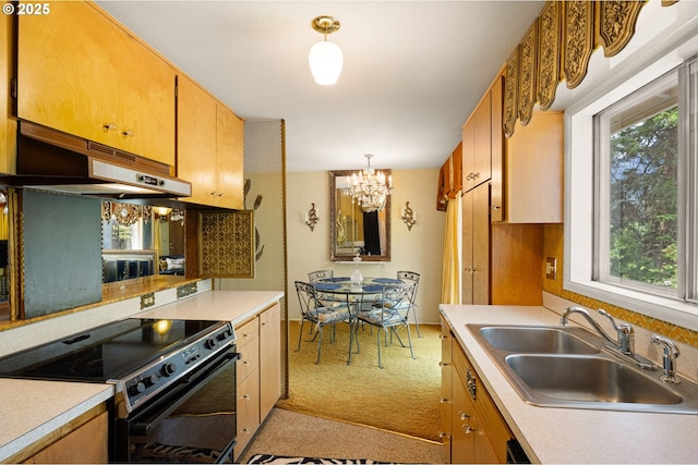 kitchen with black electric range, a sink, under cabinet range hood, a chandelier, and plenty of natural light