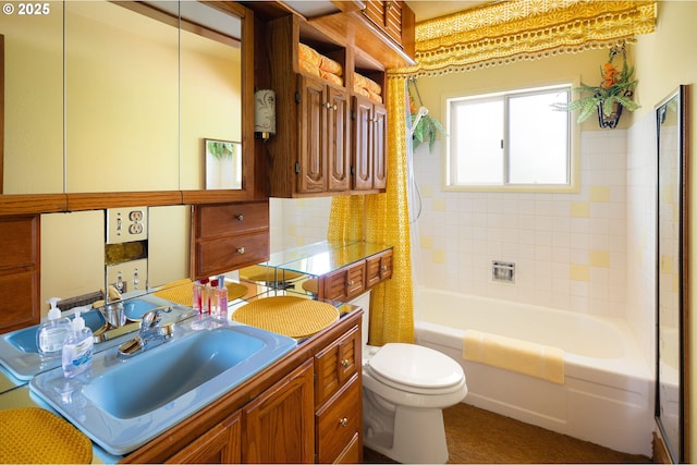 full bathroom with toilet, shower / tub combo with curtain, and vanity