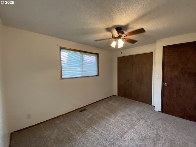 845 Waite St, Eugene, OR 97402 - unfurnished bedroom with carpet flooring, a textured ceiling, and a ceiling fan