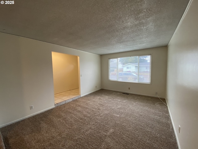 845 Waite St, Eugene, OR 97402 - carpeted spare room featuring a textured ceiling and baseboards
