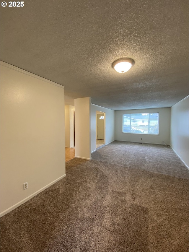 845 Waite St, Eugene, OR 97402 - carpeted spare room featuring a textured ceiling and baseboards