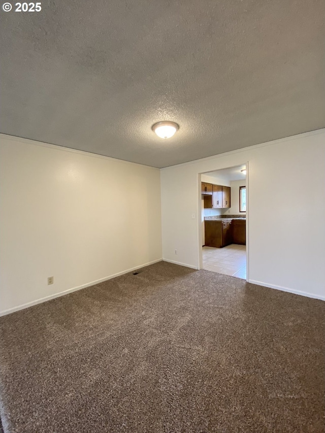 845 Waite St, Eugene, OR 97402 - spare room with light carpet, a textured ceiling, and baseboards