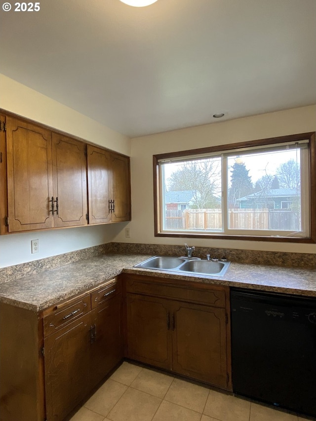 845 Waite St, Eugene, OR 97402 - kitchen with black dishwasher, a sink, plenty of natural light, and light tile patterned floors