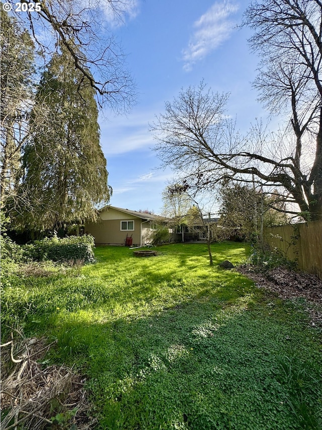 view of yard with fence