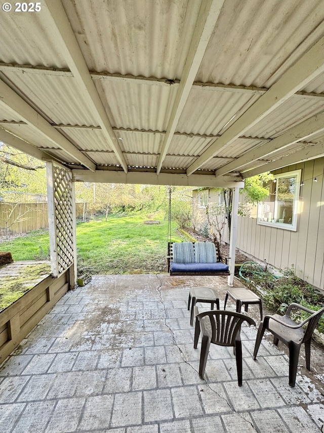 view of patio featuring fence