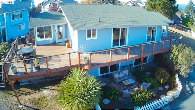 rear view of house with a wooden deck