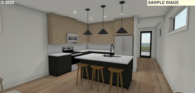 kitchen with pendant lighting, light brown cabinets, white appliances, backsplash, and a kitchen island with sink