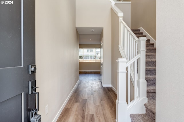 foyer with light hardwood / wood-style flooring