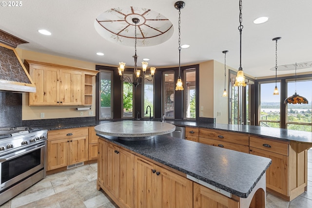 632 W T St, Washougal, WA 98671 - kitchen with appliances with stainless steel finishes, open shelves, a kitchen island, a chandelier, and dark countertops