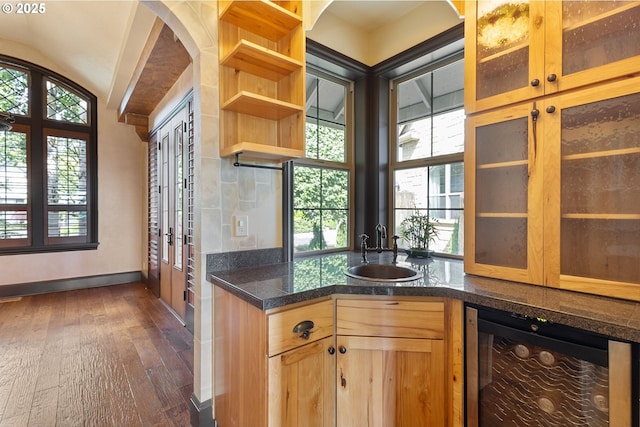 632 W T St, Washougal, WA 98671 - kitchen featuring wine cooler, a sink, dark wood-style floors, baseboards, and arched walkways