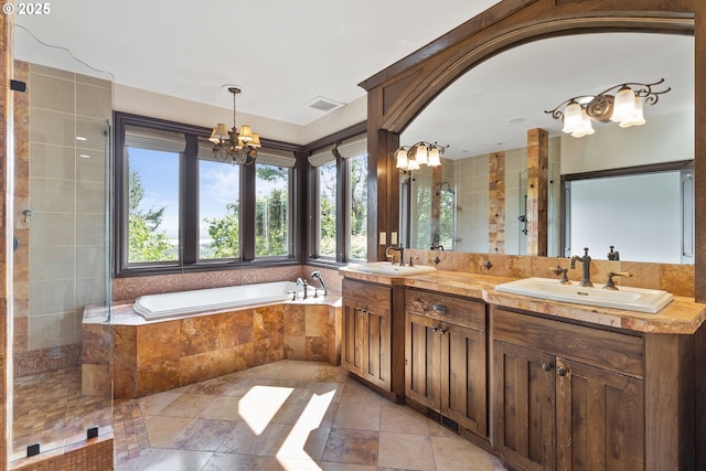 632 W T St, Washougal, WA 98671 - bathroom with a chandelier, double vanity, a bath, and stone tile flooring