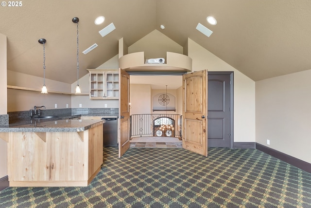 632 W T St, Washougal, WA 98671 - kitchen featuring dark colored carpet, a sink, a skylight, lofted ceiling, and light brown cabinetry