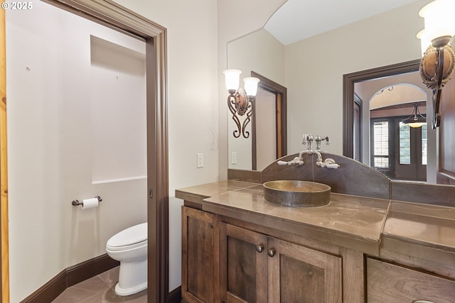 632 W T St, Washougal, WA 98671 - bathroom featuring vanity, toilet, tile patterned floors, and baseboards