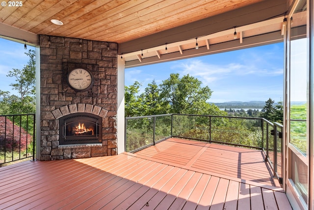 632 W T St, Washougal, WA 98671 - wooden terrace featuring an outdoor stone fireplace and a mountain view