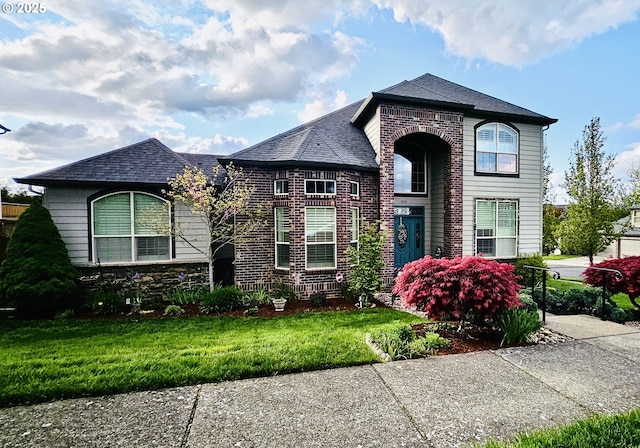 3313 NW Sierra Dr, Camas, WA 98607 - french country home with a front yard and brick siding