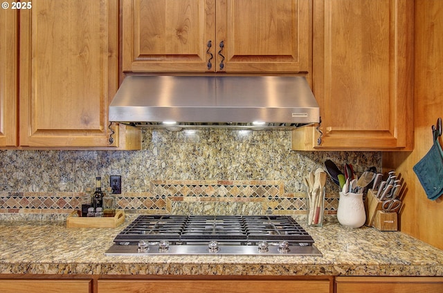 3313 NW Sierra Dr, Camas, WA 98607 - kitchen with under cabinet range hood, stainless steel gas cooktop, decorative backsplash, and light countertops