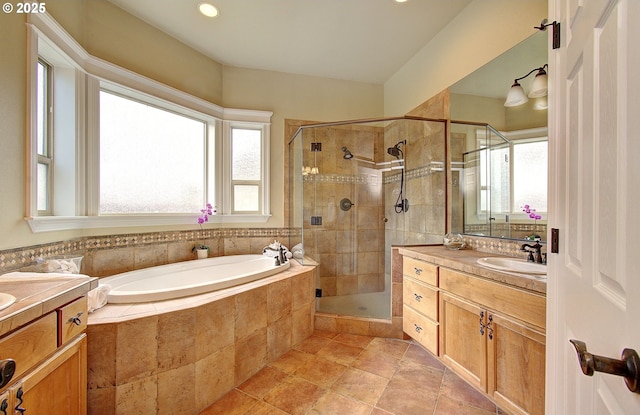3313 NW Sierra Dr, Camas, WA 98607 - full bathroom with vanity, a stall shower, a garden tub, plenty of natural light, and recessed lighting