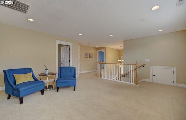 3313 NW Sierra Dr, Camas, WA 98607 - living area featuring an upstairs landing, carpet, baseboards, recessed lighting, and a chandelier
