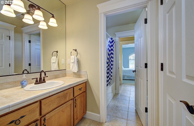 3313 NW Sierra Dr, Camas, WA 98607 - bathroom with vanity, tile patterned flooring, and baseboards