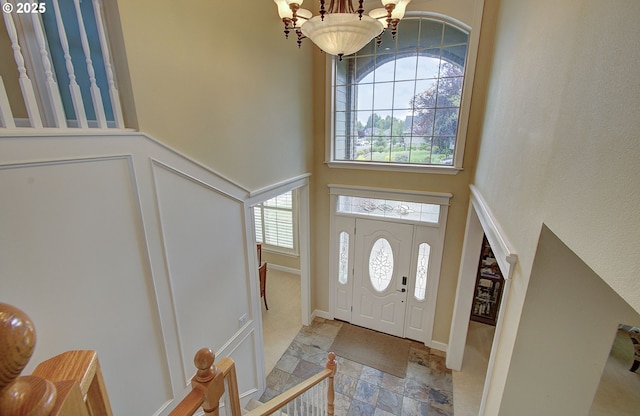 3313 NW Sierra Dr, Camas, WA 98607 - foyer featuring a chandelier, stone tile floors, and a towering ceiling