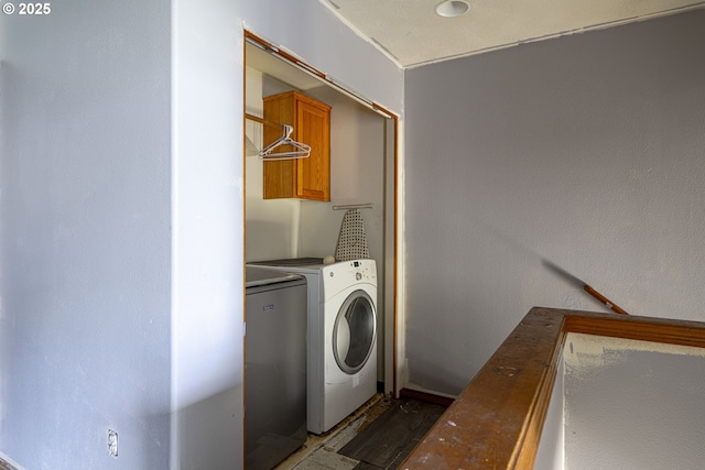 912 SE 193rd Ave, Portland, OR 97233 - laundry room with cabinet space, wood finished floors, and washer and dryer