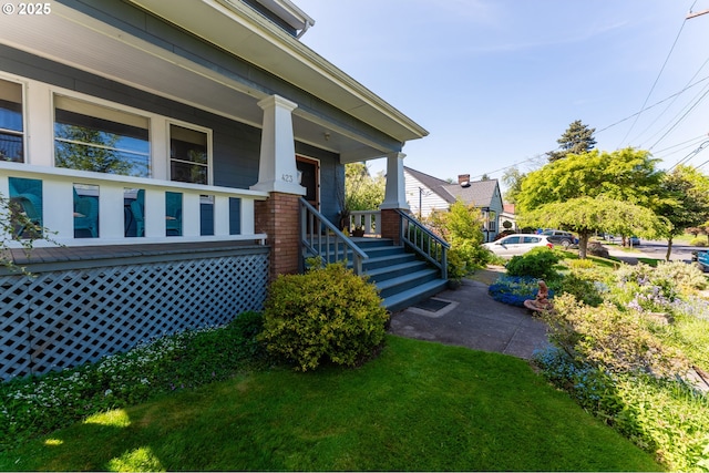 entrance to property featuring covered porch