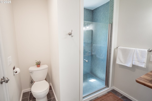 28788 Gimpl Hill Rd, Eugene, OR 97402 - bathroom featuring tile patterned floors, toilet, a shower stall, and baseboards