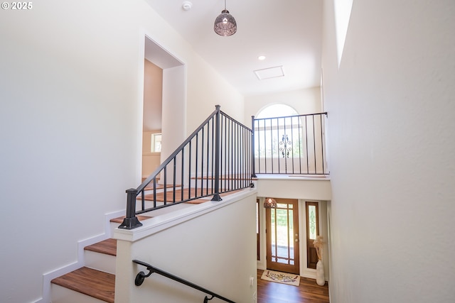28788 Gimpl Hill Rd, Eugene, OR 97402 - stairway with wood finished floors, a high ceiling, and baseboards