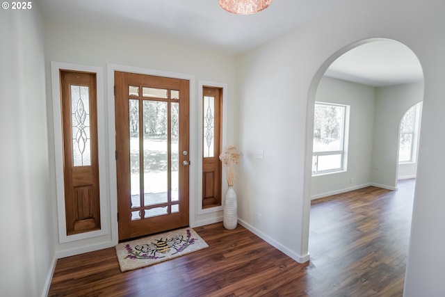 28788 Gimpl Hill Rd, Eugene, OR 97402 - entrance foyer with arched walkways, dark wood-style flooring, and baseboards