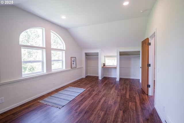 28788 Gimpl Hill Rd, Eugene, OR 97402 - unfurnished bedroom featuring lofted ceiling, dark wood-type flooring, baseboards, recessed lighting, and two closets