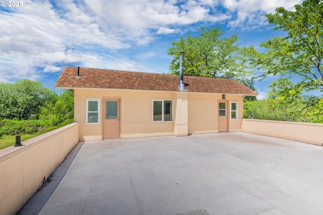 28788 Gimpl Hill Rd, Eugene, OR 97402 - back of house featuring stucco siding, a patio area, and roof with shingles