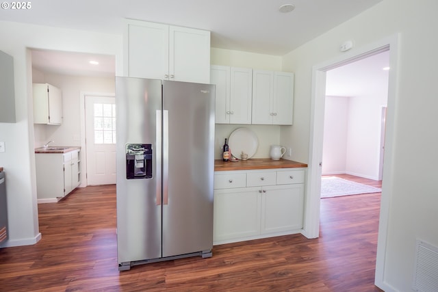 28788 Gimpl Hill Rd, Eugene, OR 97402 - kitchen with stainless steel fridge, dark wood-type flooring, white cabinets, a sink, and baseboards