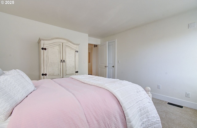 bedroom featuring light carpet, baseboards, and visible vents