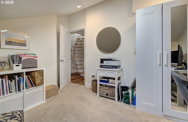 interior space with lofted ceiling, carpet, and recessed lighting