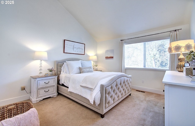 bedroom with baseboards, visible vents, vaulted ceiling, and light colored carpet