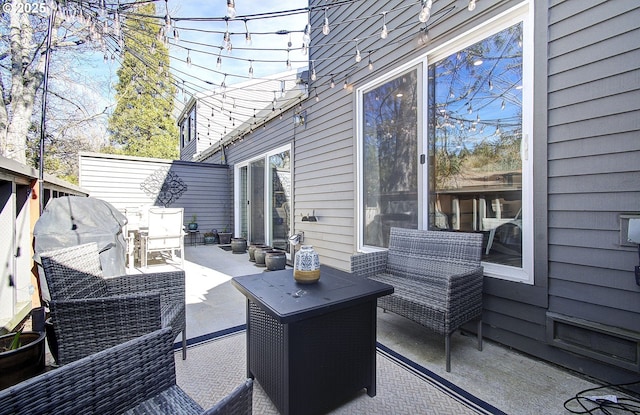 wooden deck with outdoor lounge area and a patio area