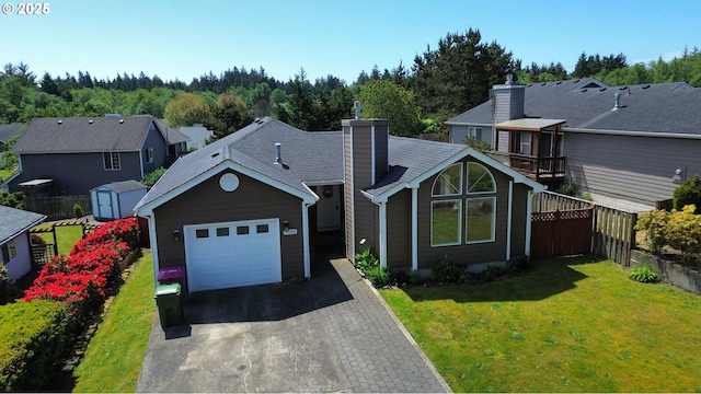 1540 7th Dr, Hammond, OR 97121 - view of front facade with asphalt driveway, an attached garage, and a chimney