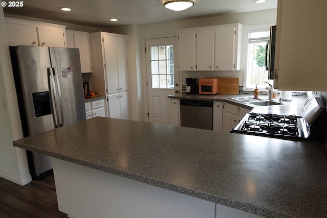1540 7th Dr, Hammond, OR 97121 - kitchen featuring stainless steel appliances, plenty of natural light, recessed lighting, a sink, and white cabinetry