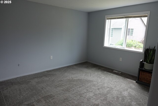 1540 7th Dr, Hammond, OR 97121 - empty room featuring carpet flooring and baseboards