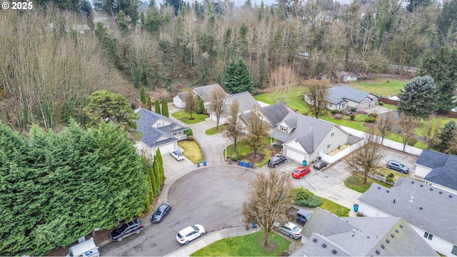 aerial view featuring a residential view and a view of trees