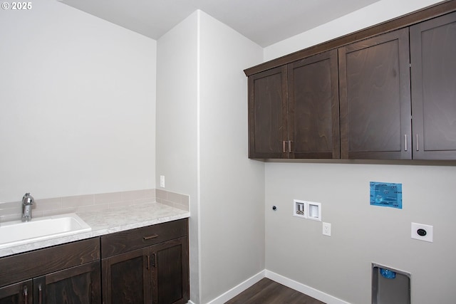 clothes washing area featuring sink, dark hardwood / wood-style floors, cabinets, washer hookup, and hookup for an electric dryer