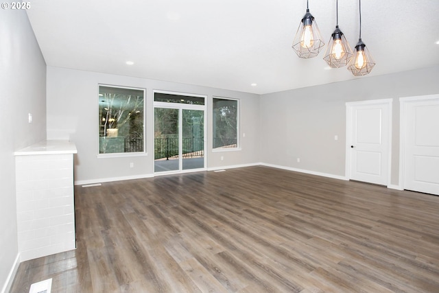 unfurnished room with dark hardwood / wood-style floors