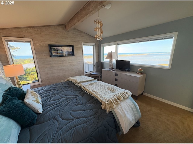 carpeted bedroom featuring wood walls, lofted ceiling with beams, baseboards, and an accent wall